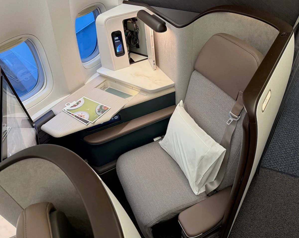 Staggered layouts trade density for privacy — Cathay's Aria Suite is the current benchmark