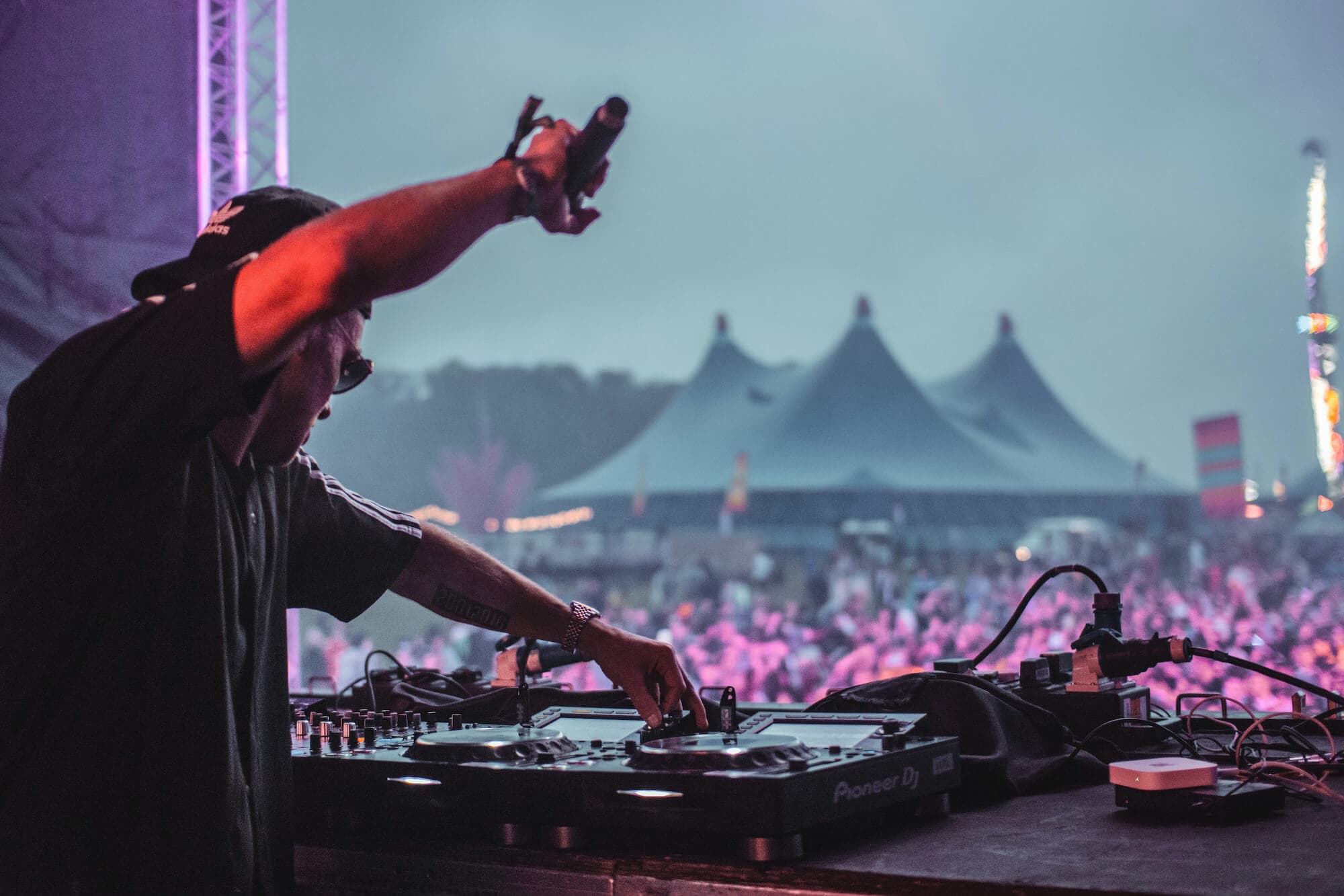 Electrifying the crowd, a DJ sets the rhythm of the night at the world-renowned Coachella Music Festival. Photo by Arthur Edelmans.