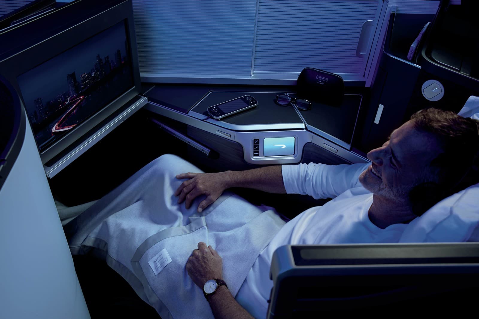 Business Class seat and in-flight entertainment in the British Airways Club Suite. Photo by British Airways.