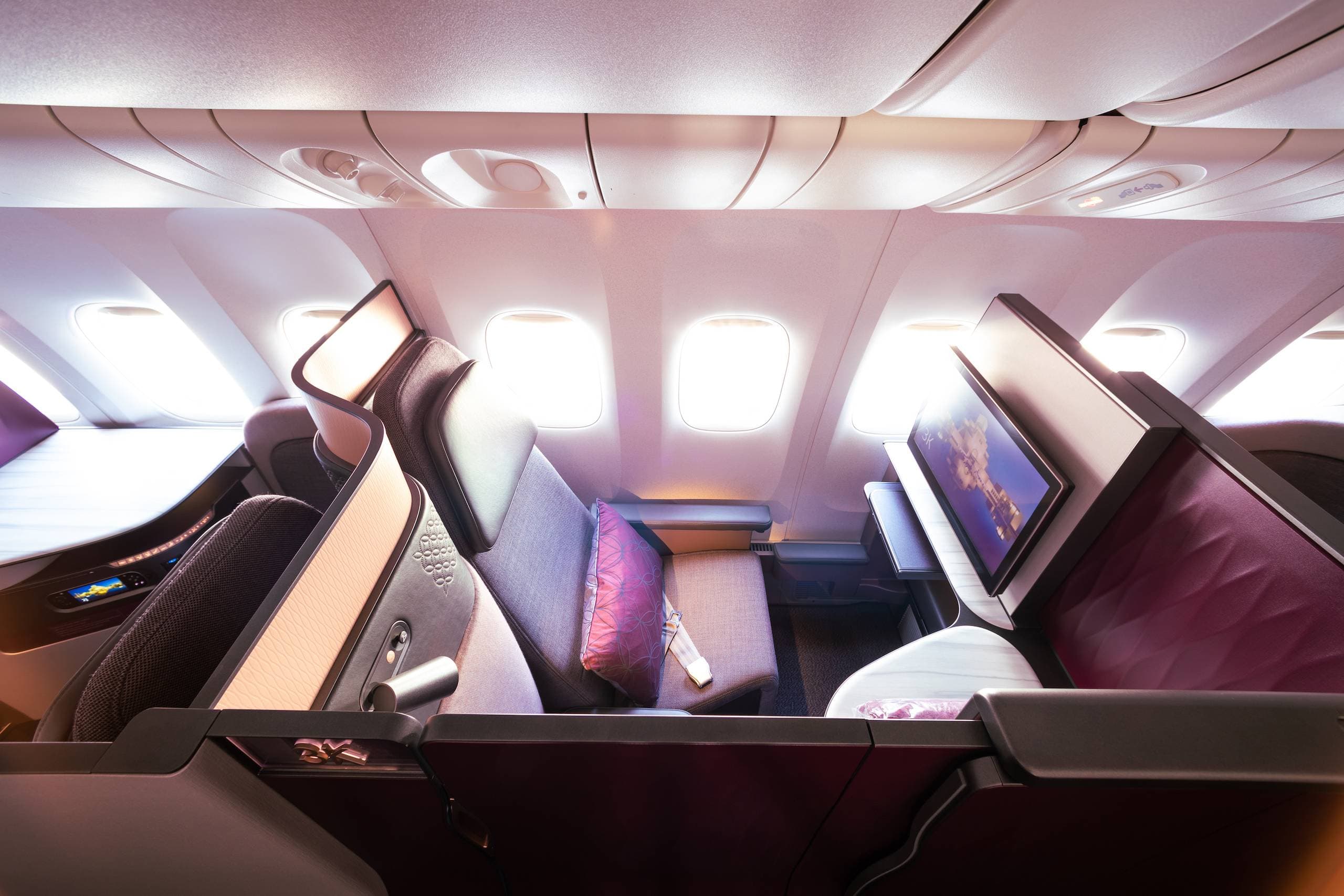 Qatar Airways' fully private business class Qsuite. Photo by Qatar Airways.