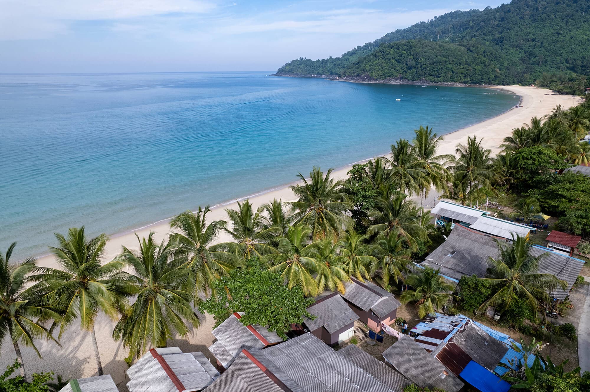 Juara Beach, a tropical paradise located on the stunning Tioman Island, beckons visitors with its crystal clear waters and white sandy shores.