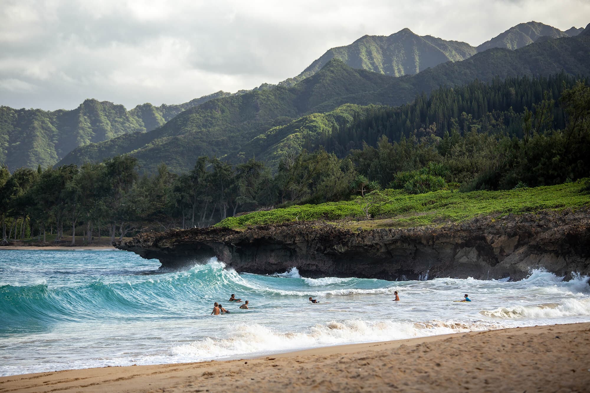 Road tripping around Oahu, exploring its northern beaches to catch some sun and watch local surfers riding the waves. Photo by Luke McKeown