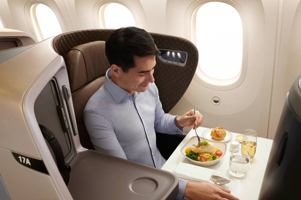 Dine in a restaurant-like setting onboard in Business Class, complete with full table service and wines selected to complement your meal, which can be pre-ordered up to 24 hours before your flight.