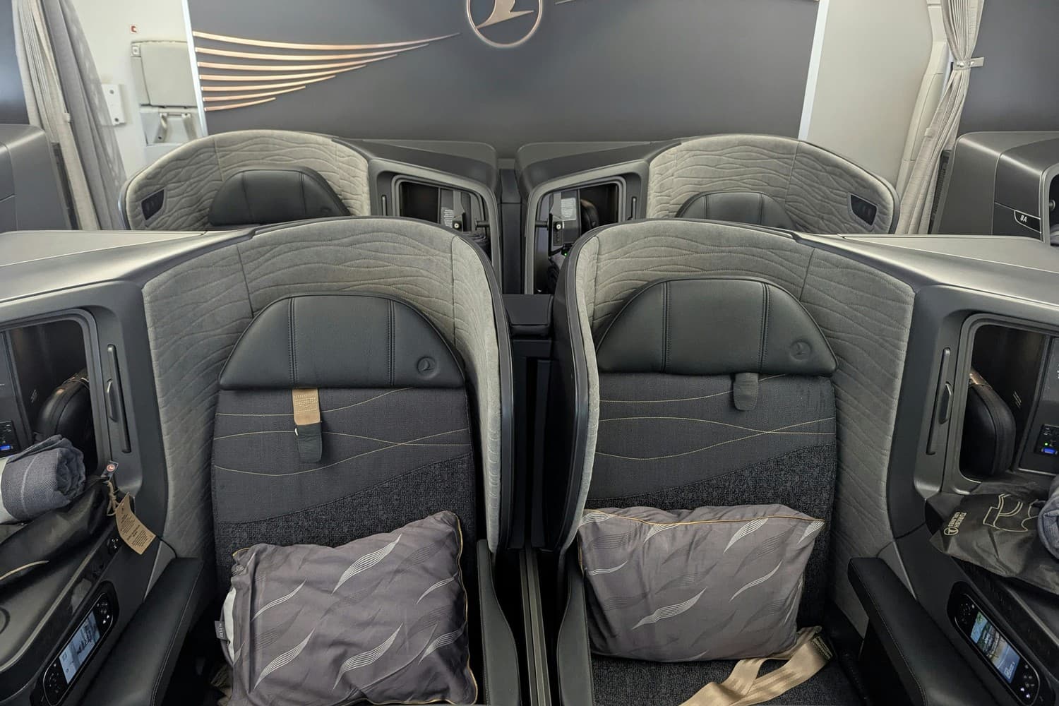 Selected center seats in Turkish Airlines Business Class, designed for couples traveling together with adjustable privacy and direct aisle access. Photo by Frugal Flyer.