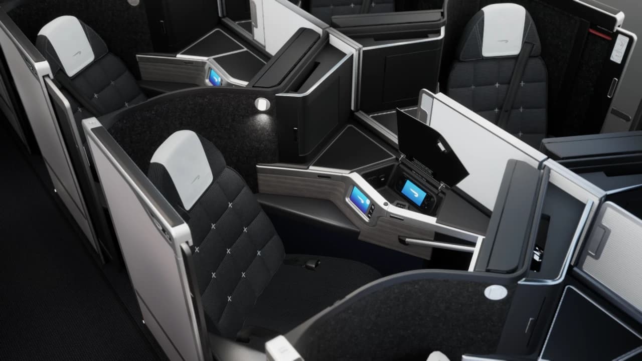 British Airways Club Suite in lie-flat bed mode on a Boeing 777 — the enclosed suite with privacy door transformed transatlantic business class