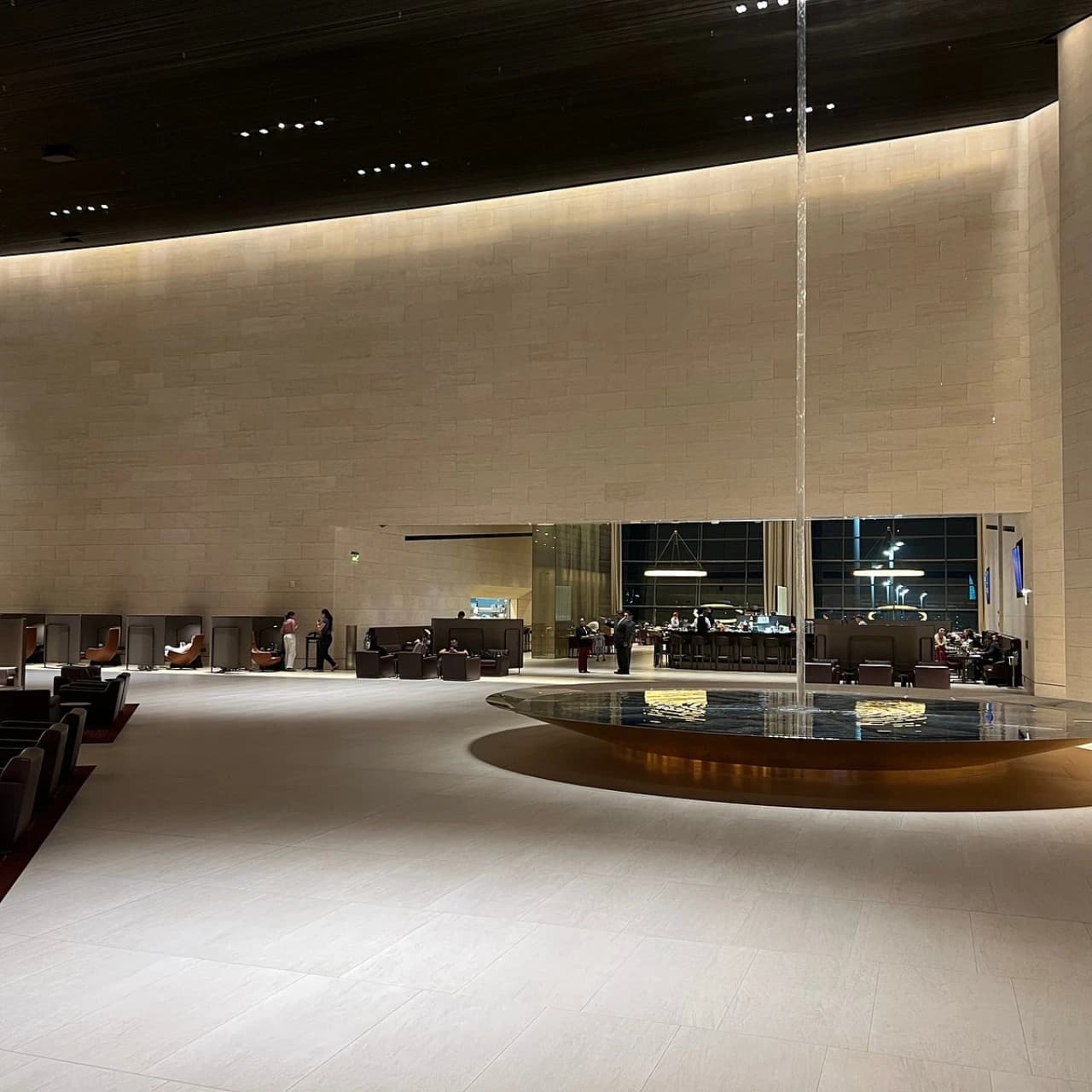 Al Safwa First Lounge at Hamad International Airport — spacious seating areas with dramatic architecture and contemporary Middle Eastern design