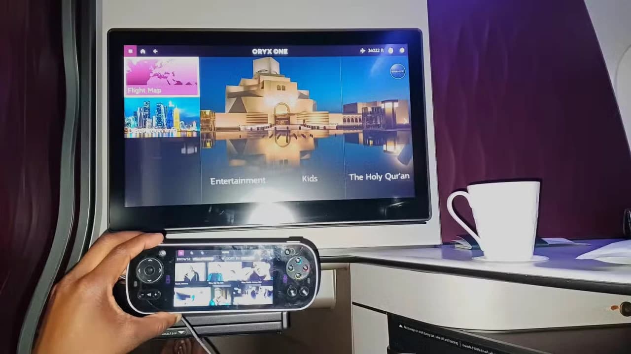 QSuite 21.5-inch Oryx One entertainment screen and personal suite controls — over 4,000 entertainment options at your fingertips