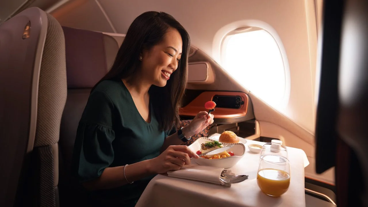 Business class meal service on a transpacific flight — Asian carriers command a premium for their world-class soft products