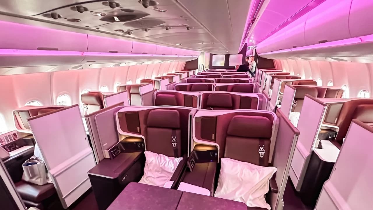 Virgin Atlantic Upper Class Suite on the A330neo — deep burgundy leather with herringbone layout and privacy partitions