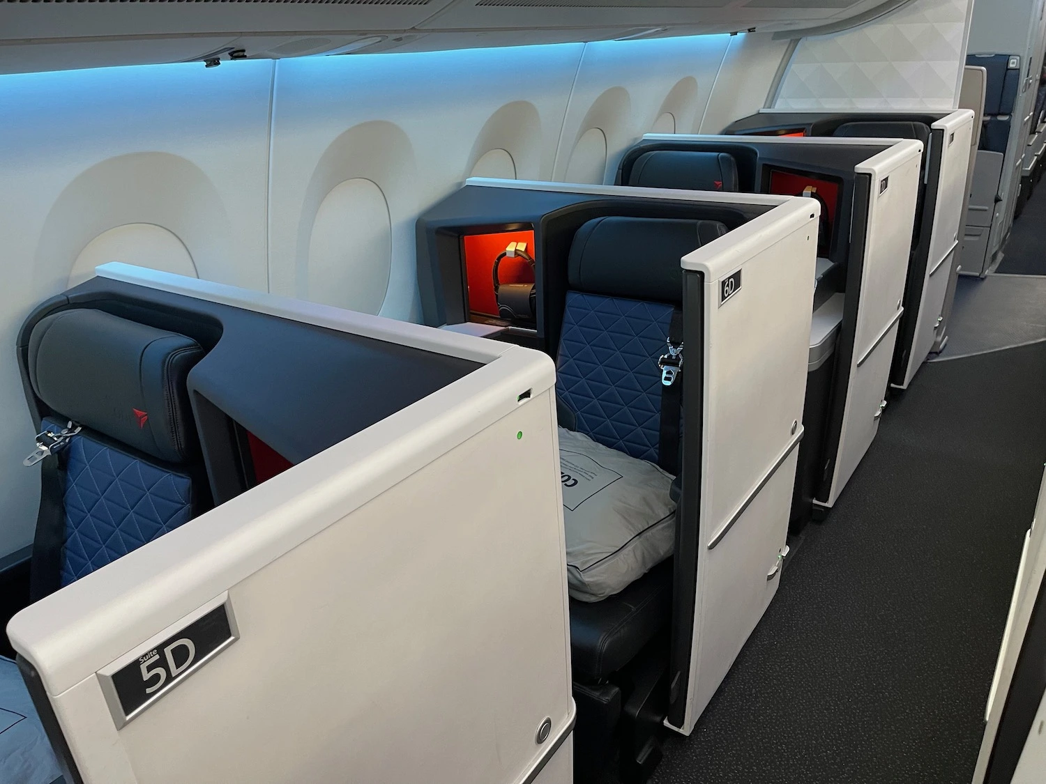 Delta One Suite delivers the same enclosed cabin on every transatlantic route — no aircraft roulette.